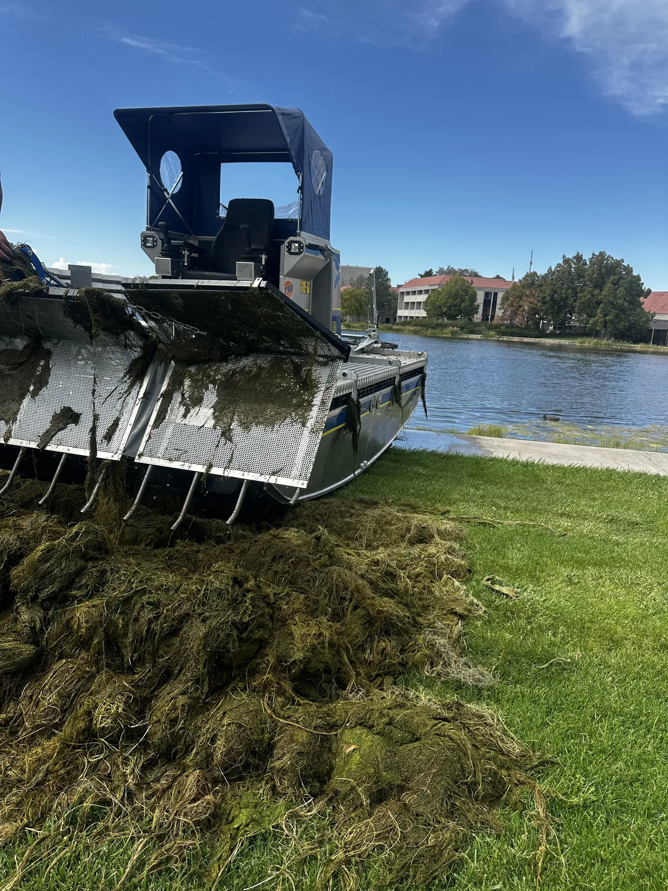 Truxor machine harvesting aquatic vegetation in Utah